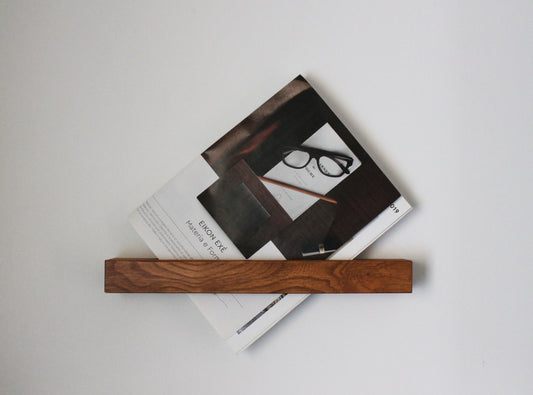 Floating wooden shelf. Modern rack for magazines or books. SLICE